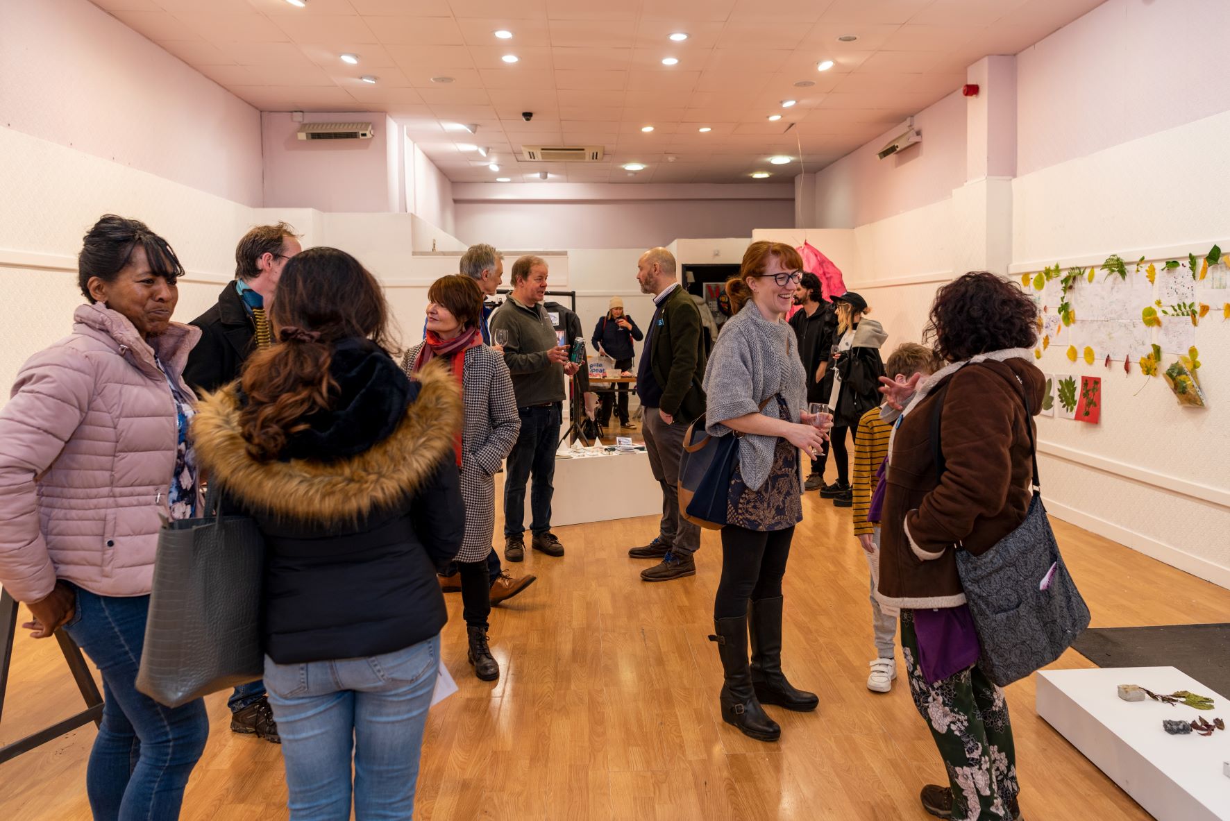 People at the opening of the Beetroot Collective exhibition in an empty shop unit that is part of the Piazza Arts Centre in Huddersfield